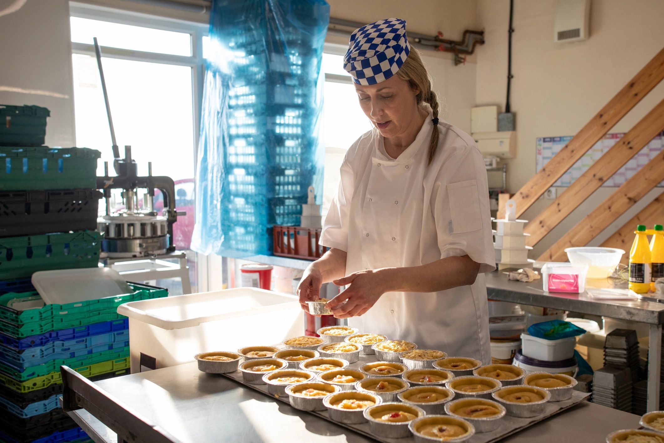 Pastry chef preparing delicate baked treats in a bakery