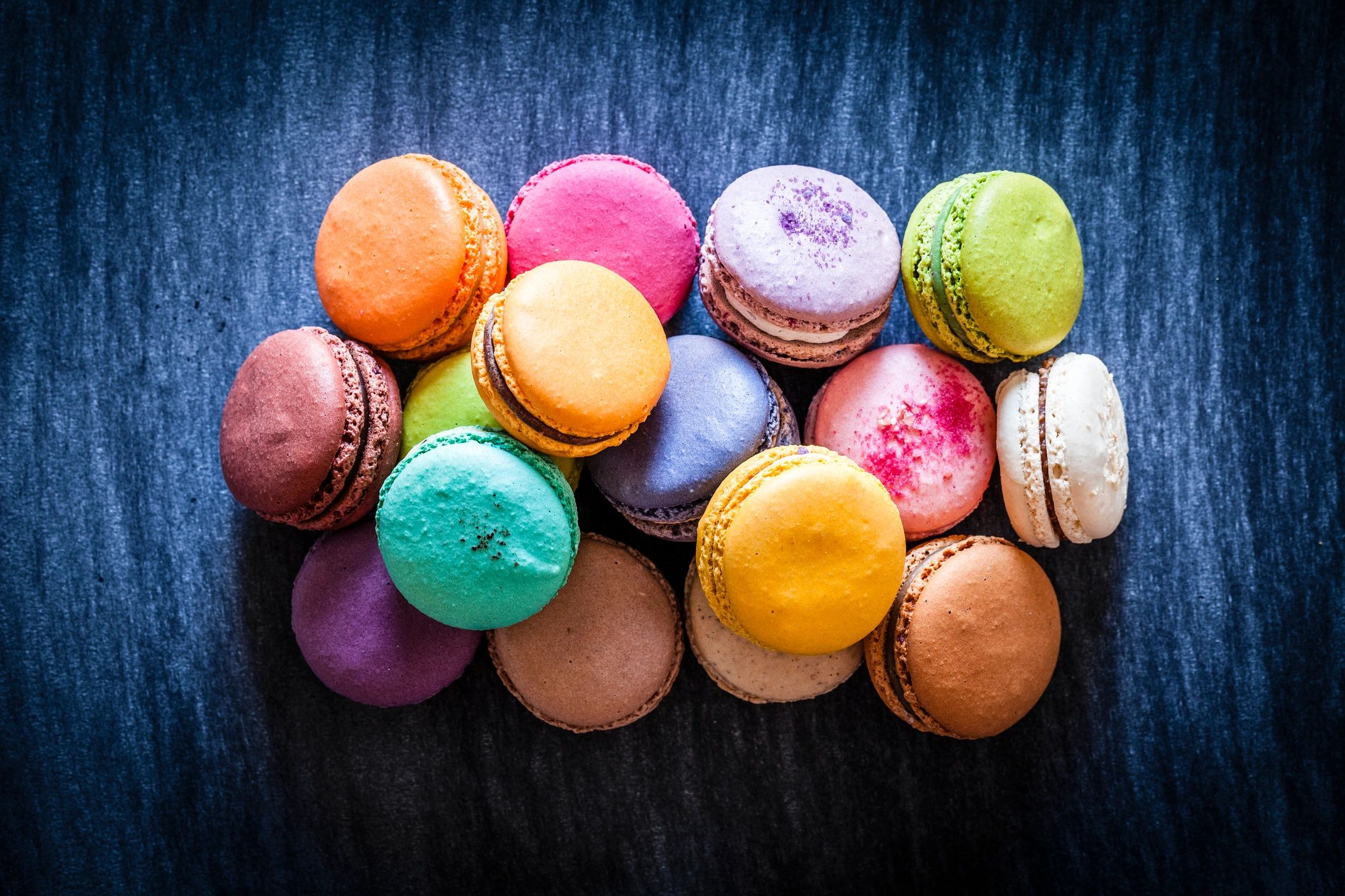 Assorted colorful French macarons arranged together